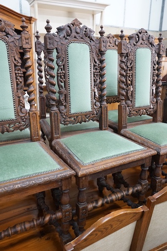 A set of six 19th century Carolean style carved oak dining chairs and one other similar chair (7)